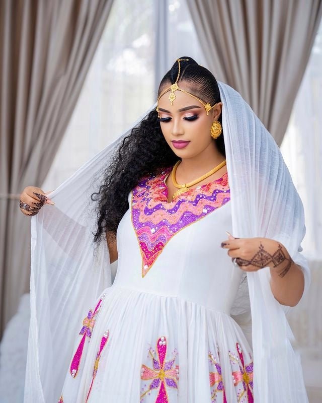 MARKAN VIBRANT HABESHA WEDDING DRESS | TRADITIONAL HABESHA KEMIS WITH PINK PURPLE AND GOLD WAVE EMBROIDERY | ETHIOPIAN HABESHA DRESS FOR CULTURAL WEAR