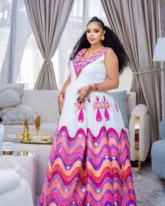 MARKAN VIBRANT HABESHA WEDDING DRESS | TRADITIONAL HABESHA KEMIS WITH PINK PURPLE AND GOLD WAVE EMBROIDERY | ETHIOPIAN HABESHA DRESS FOR CULTURAL WEAR