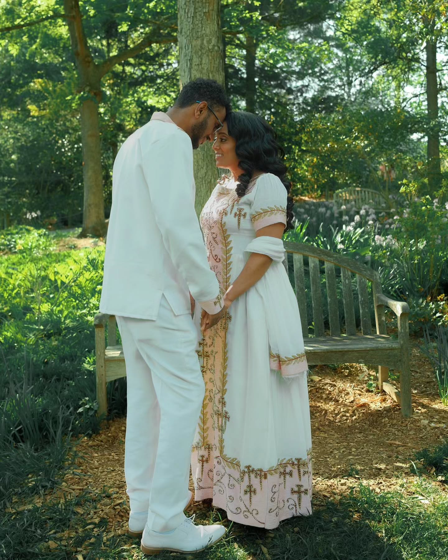 VERONICA ETHIOPIAN WEDDING COUPLE OUTFIT | WHITE HABESHA DRESS AND MEN’S SUIT | GOLD AND PINK EMBROIDERY COUPLES OUTFIT